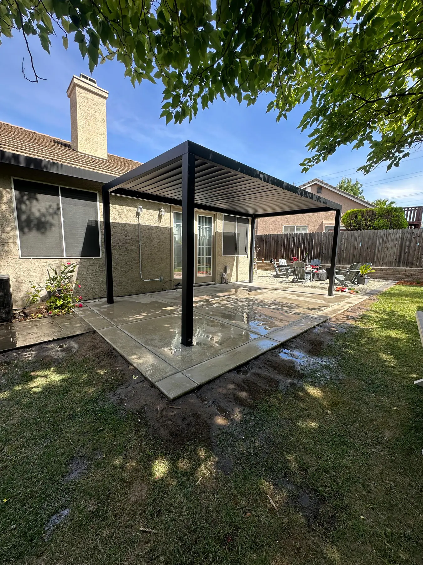 Covered patio pergola over concrete outdoor living space
